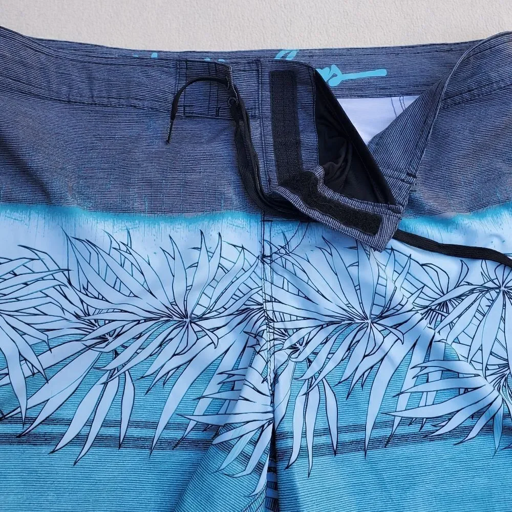 Maui and Sons blue gray and black board shorts